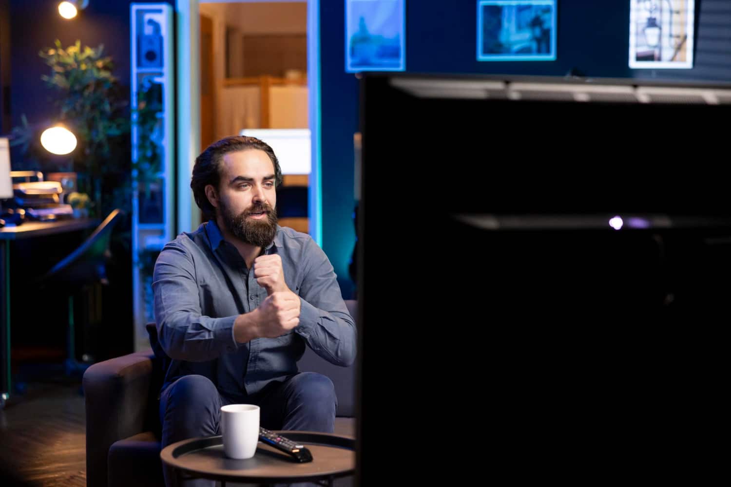 Local Peoria business owner watching their TV advertisement, highlighting the impact of media and marketing strategies.